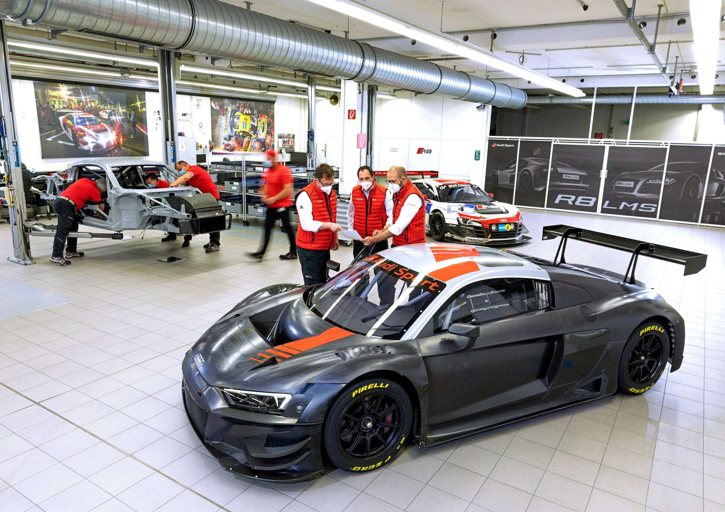 Audi R8 Races Motorcycles