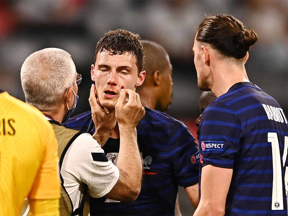 Benjamin Pavard receives medical attention. (Reuters Photo)