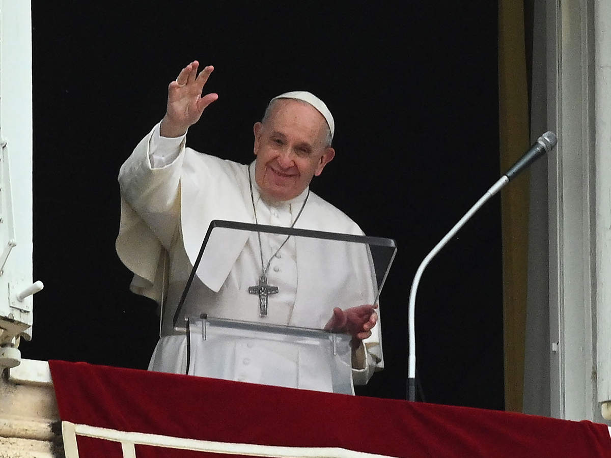 Pope Francis waves as he addresses the crowd from the window of the apostolic palace overlooking St.Peter's square during his Sunday Angelus prayer at the Vatican on June 20 (AFP)