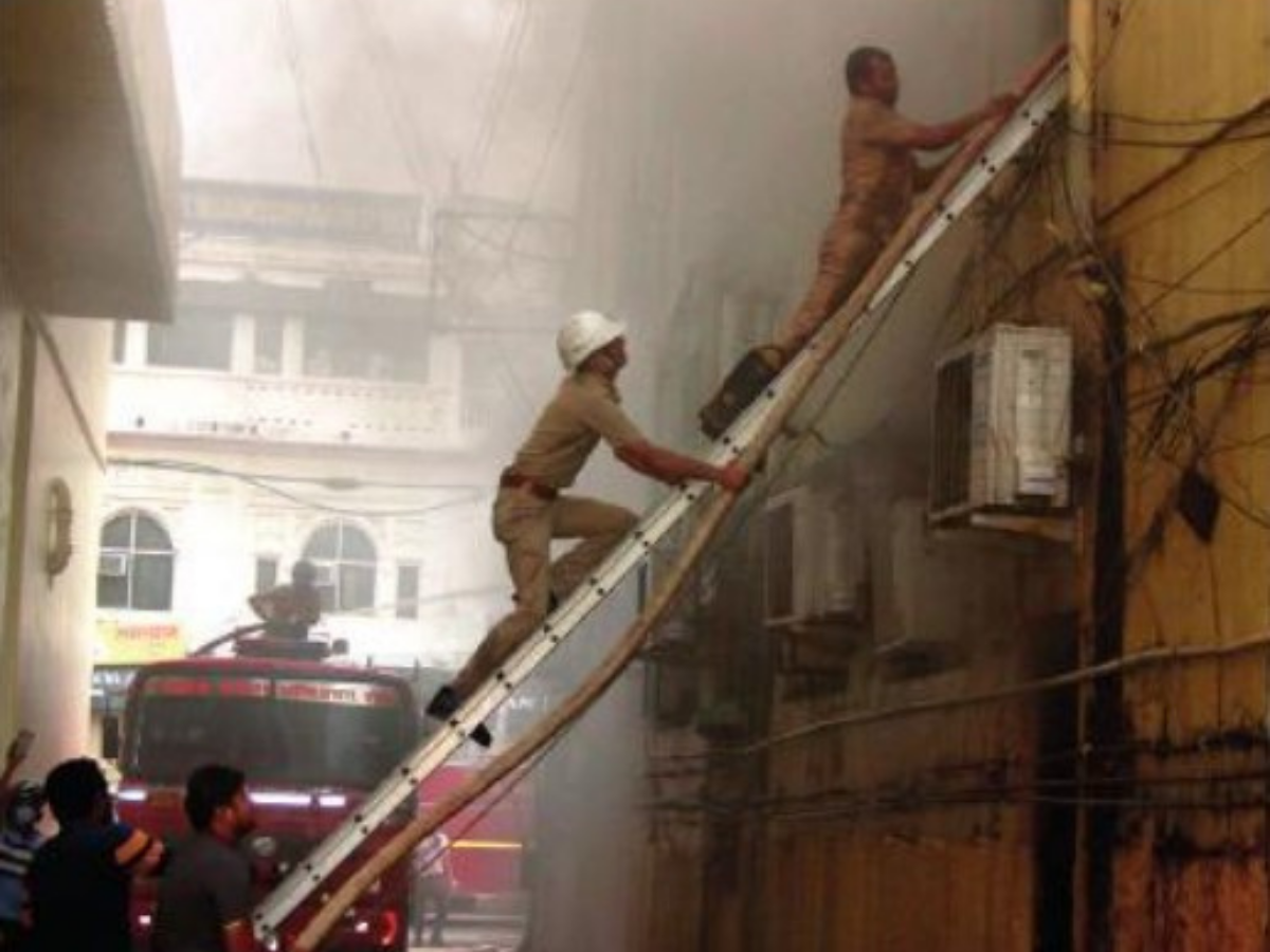 Firemen carry out rescue operation at Halwasiya building on Sunday.