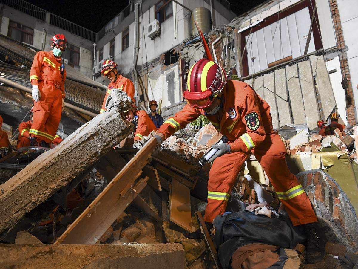 In this photo released by Xinhua News Agency, rescuers search for survivors at a collapsed hotel in Suzhou in eastern China's Jiangsu Province, Monday, July 12, 2021. (AP)