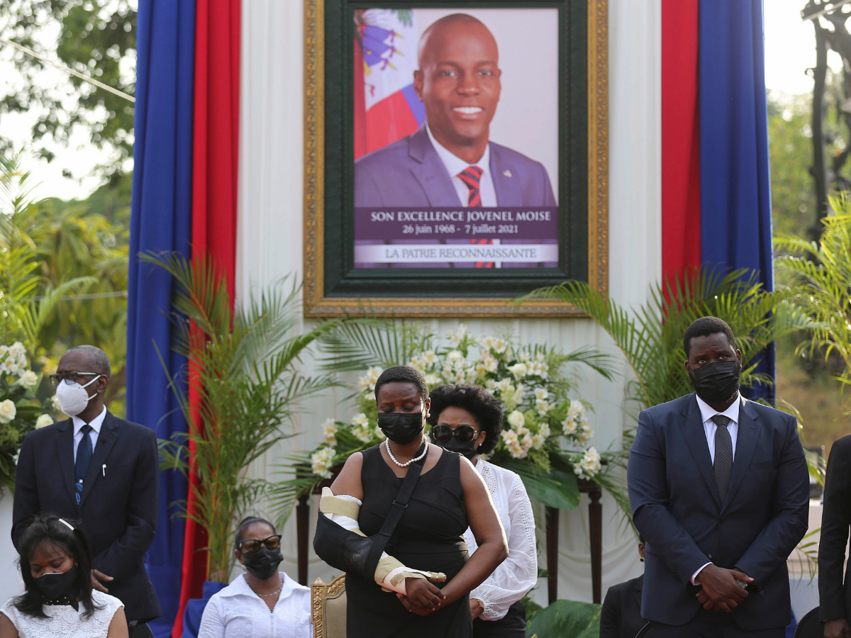 First Lady, Martine Moise, center, attends a tribute for her late husband President Jovenel Moise at the National Pantheon Museum in Port-au-Prince Haiti. (Credits: AP)