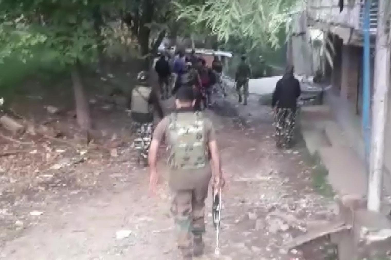 National Investigation Agency (NIA) is conducting raids at multiple locations in Jammu and Kashmir related to a terror funding case Visuals from Anantnag district. (ANI)