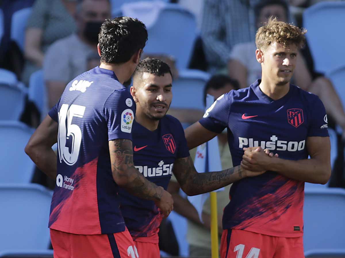 Atletico Madrid's Angel Correa celebrates scoring their second goal with teammates Stefan Savic and Marcos Llorente. (Reuters Photo)
