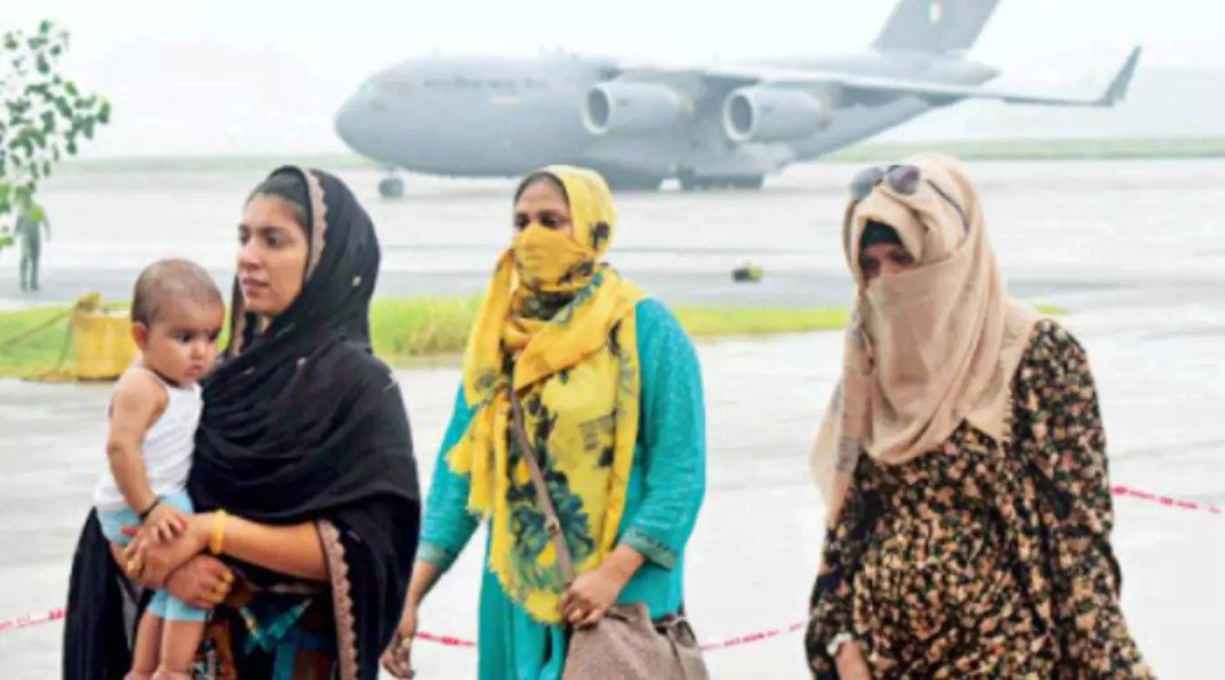 People evacuated from Afghanistan arrive at the Hindon Air Force Station in Ghaziabad on Sunday.