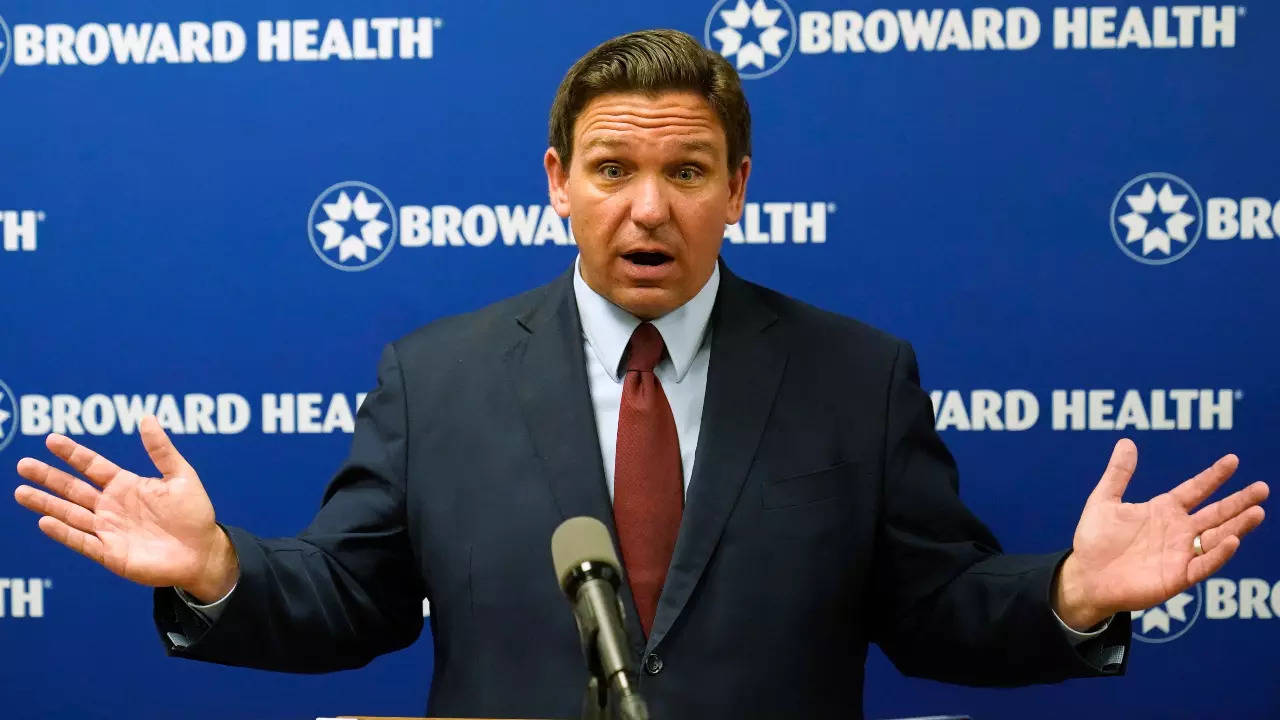Florida's Republican governor Ron DeSantis signed an order barring state agencies from assisting with the relocation of undocumented immigrants arriving in the state (AP)