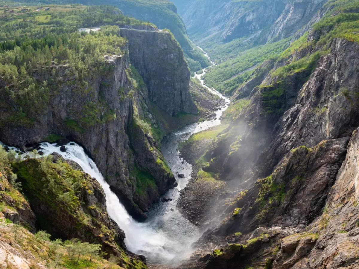 Watch this magnificent waterfall in Norway from a bridge above it