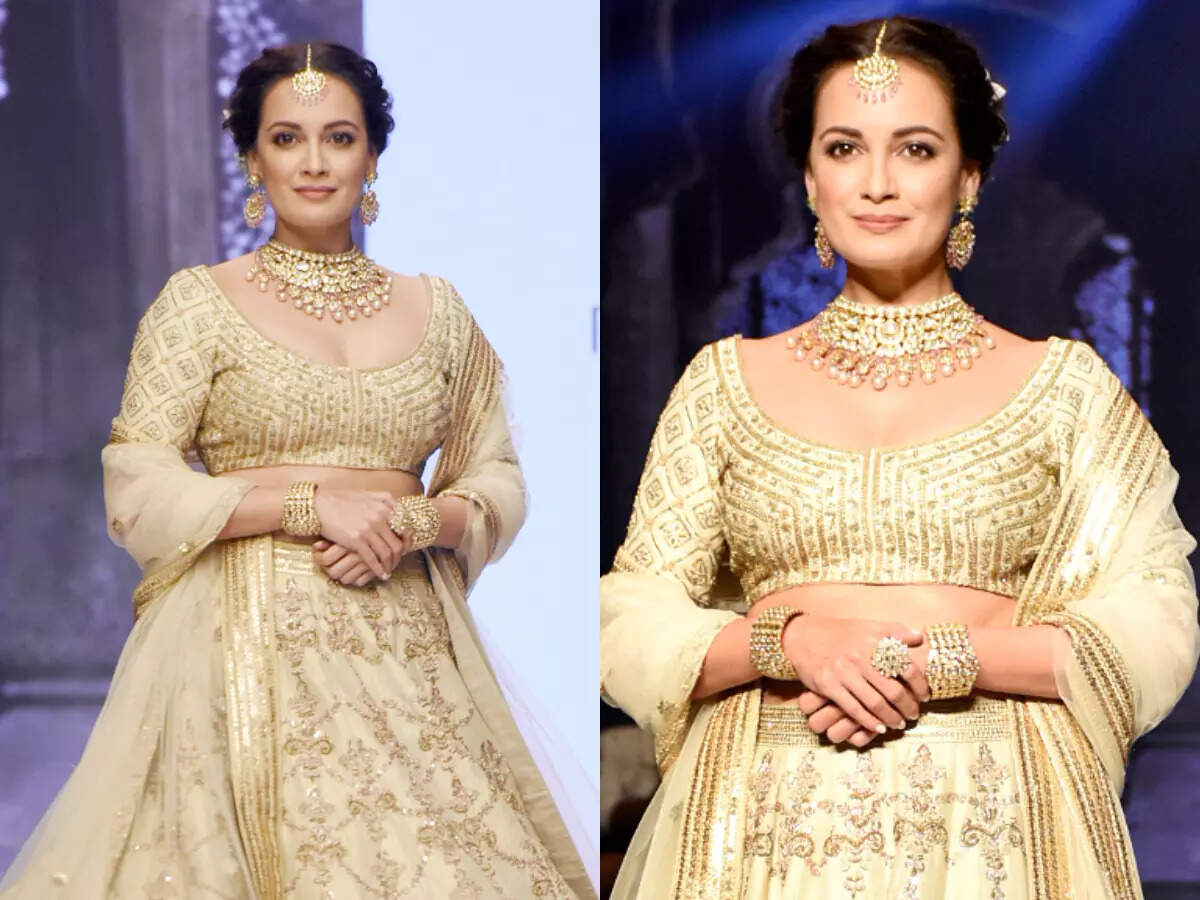 Dia Mirza stuns in a golden lehenga as she walks for Sanjev Marwaaha -  Times of India