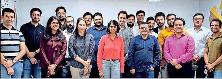 Maya Ramachandran (centre) with EY’s Gurugram team
