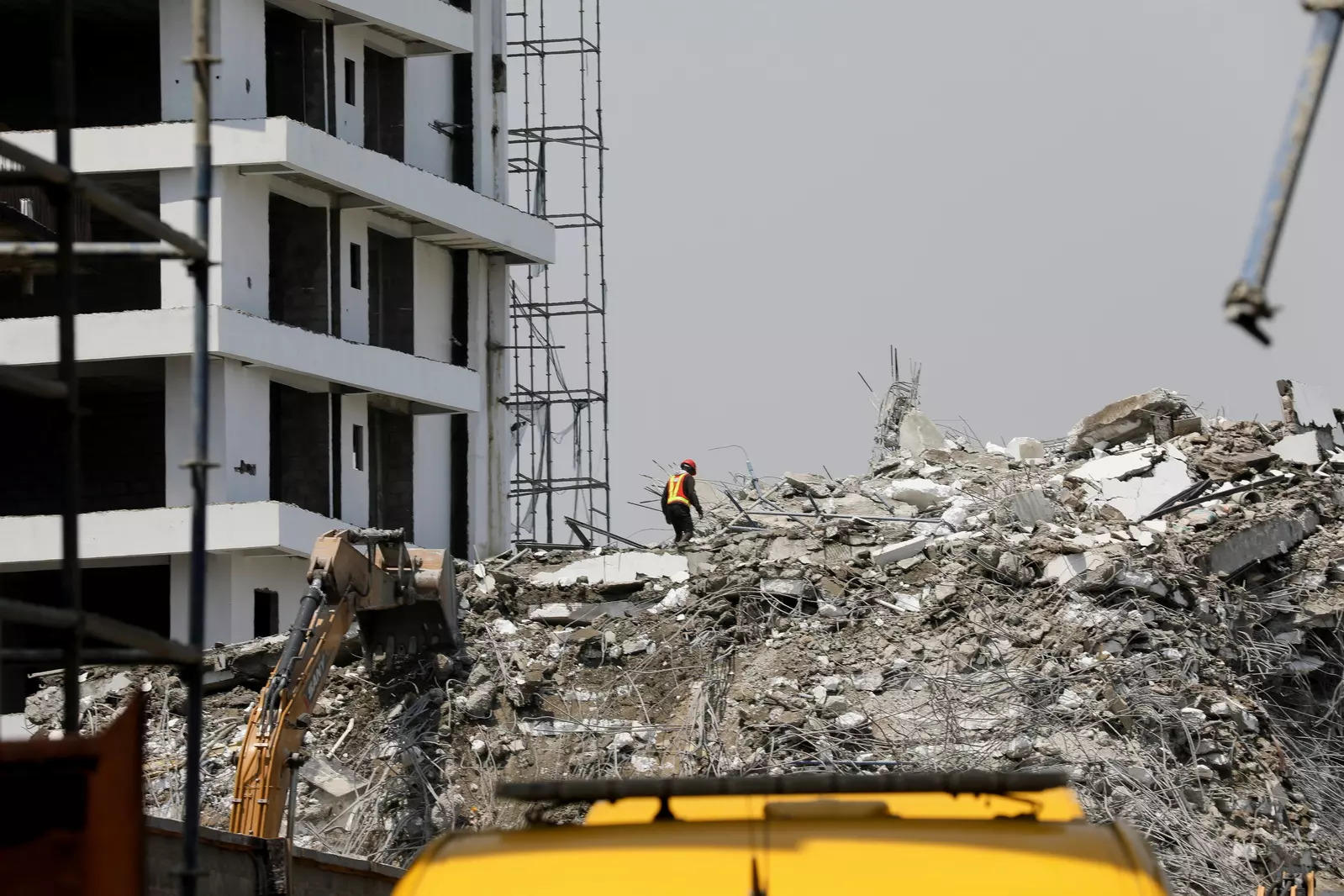 A rescue member works on the debris as search and rescue efforts continue at the site of a collapsed building in Ikoyi, Lagos, Nigeria November 2. (File photo: Reuters)