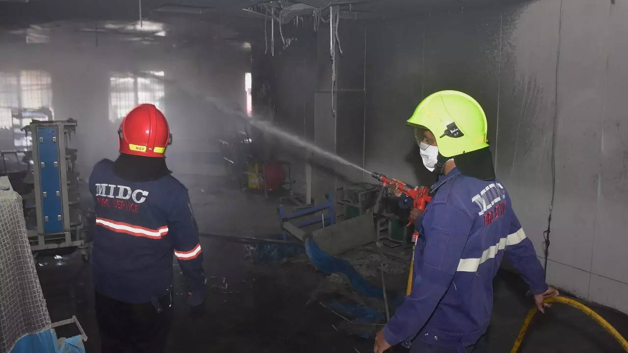  Firefighters attempt to douse the fire after it broke out at the ICU of Civil Hospital in Ahmednagar
