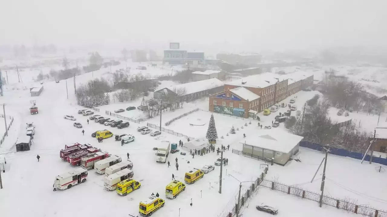 Ambulances and fire trucks are parked near the Listvyazhnaya coal mine in Siberia. (AP photo)