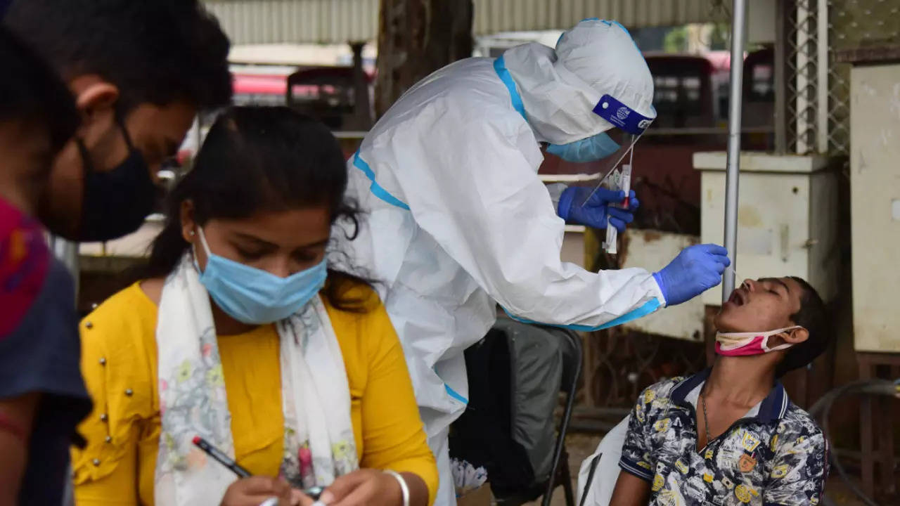 FILE: Health workers conduct swab test for Covid-19 at Kempegowda bus stand in Bengaluru — Chetan Shivakumar (TOI)