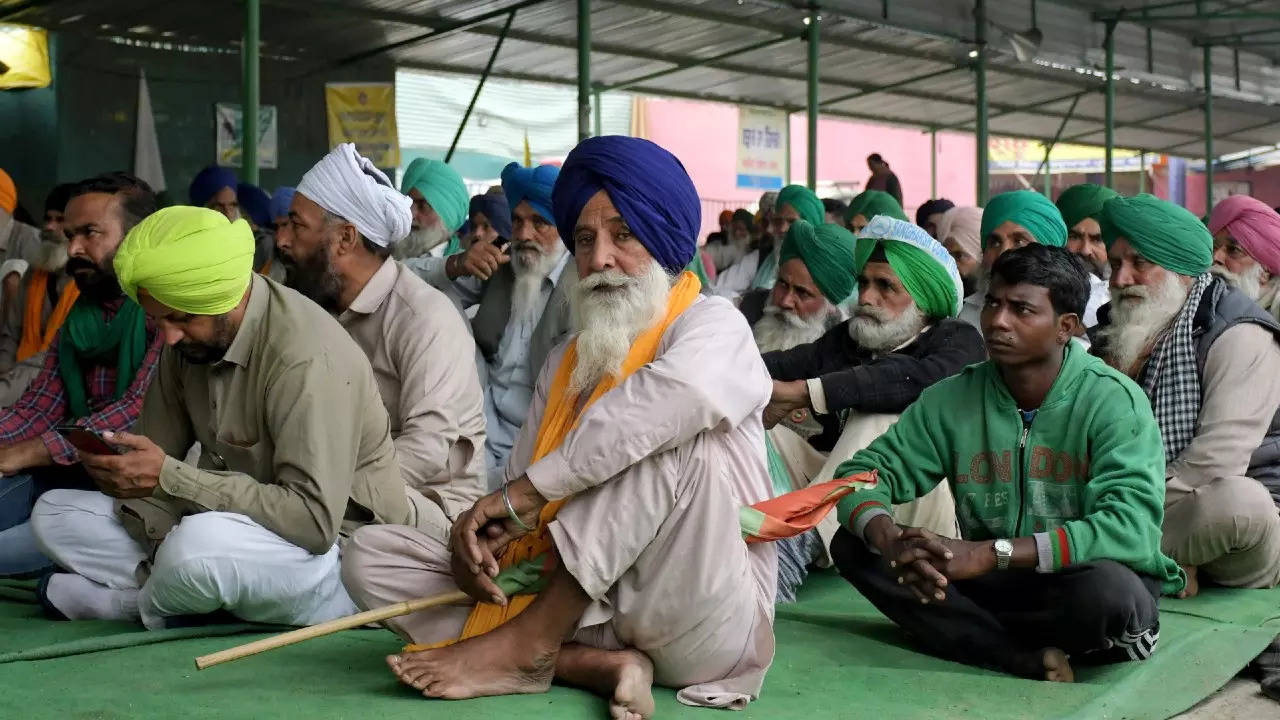 Farmers sitting at Singhu Border as part of a protest over various demands, in New Delhi on Wednesday. (ANI photo)