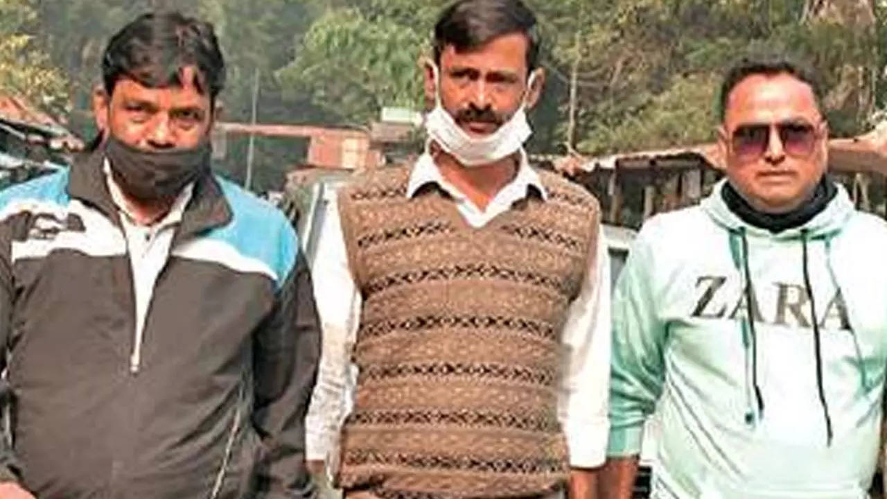 Anupam Banerjee (in middle) at the court on Thursday
