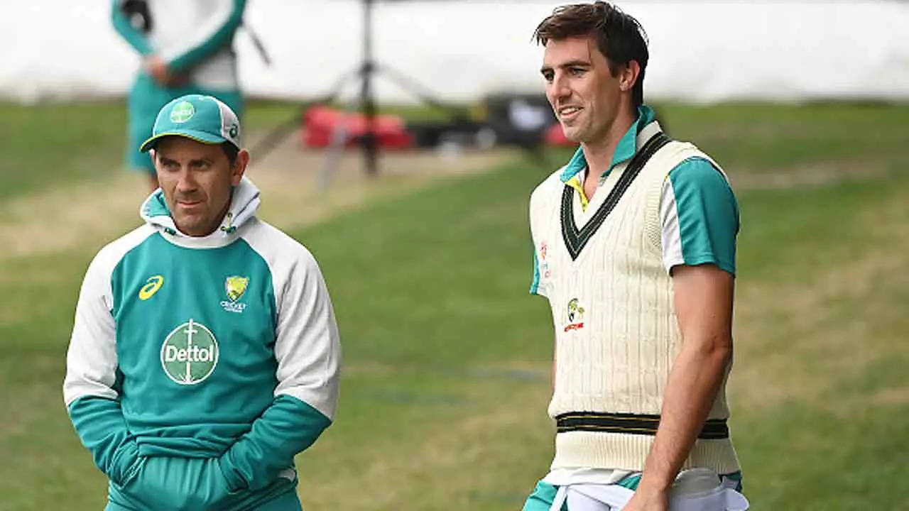 Justin Langer and Pat Cummins. (Photo by Steve Bell/Getty Images)