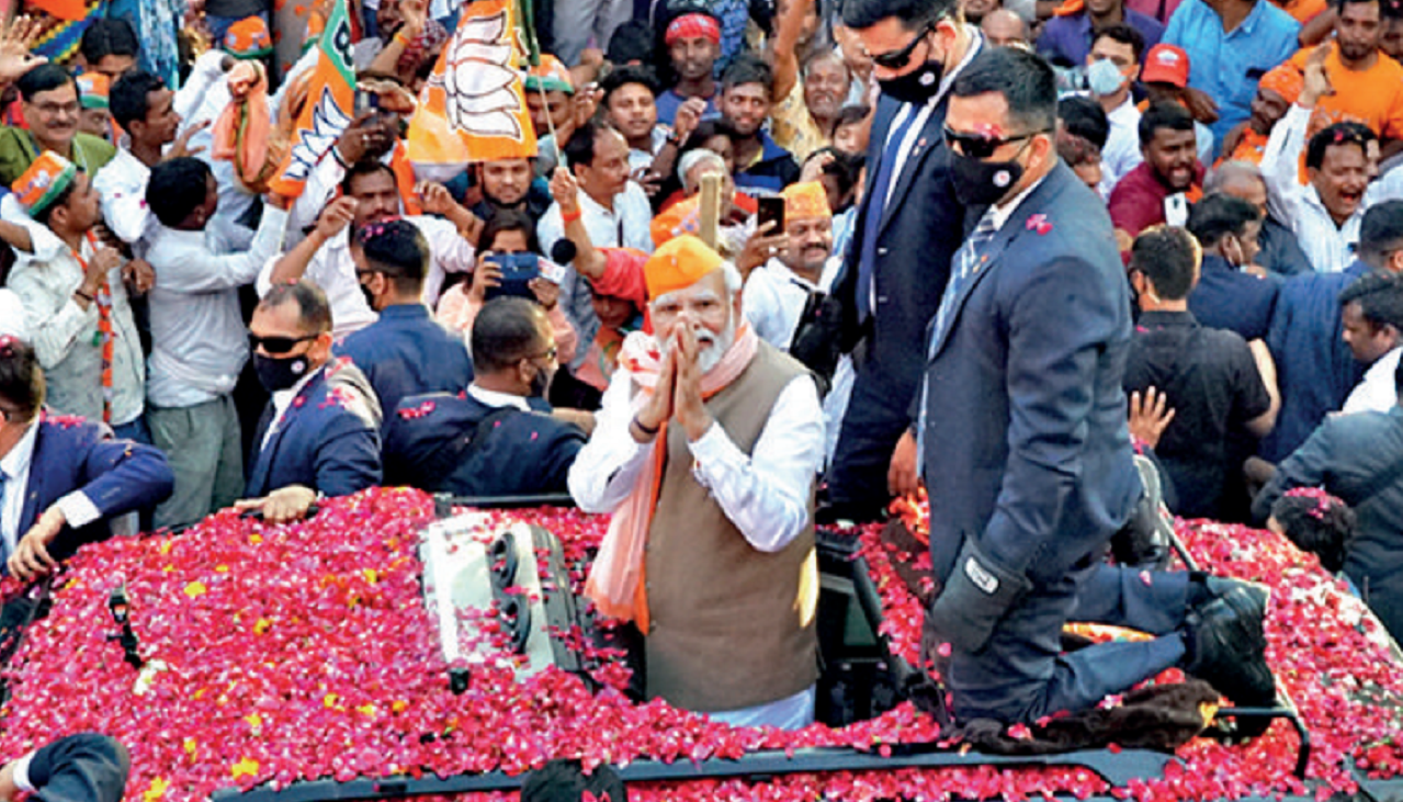 PM Narendra Modi during a roadshow in Varanasi on Friday
