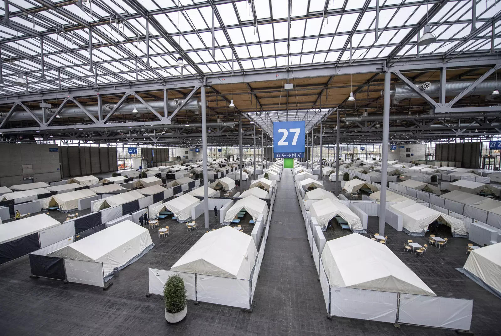 Tents are set up in preparation for the arrival of refugees from Ukraine in Hall 27 of the exhibition grounds in Hanover, Germany 