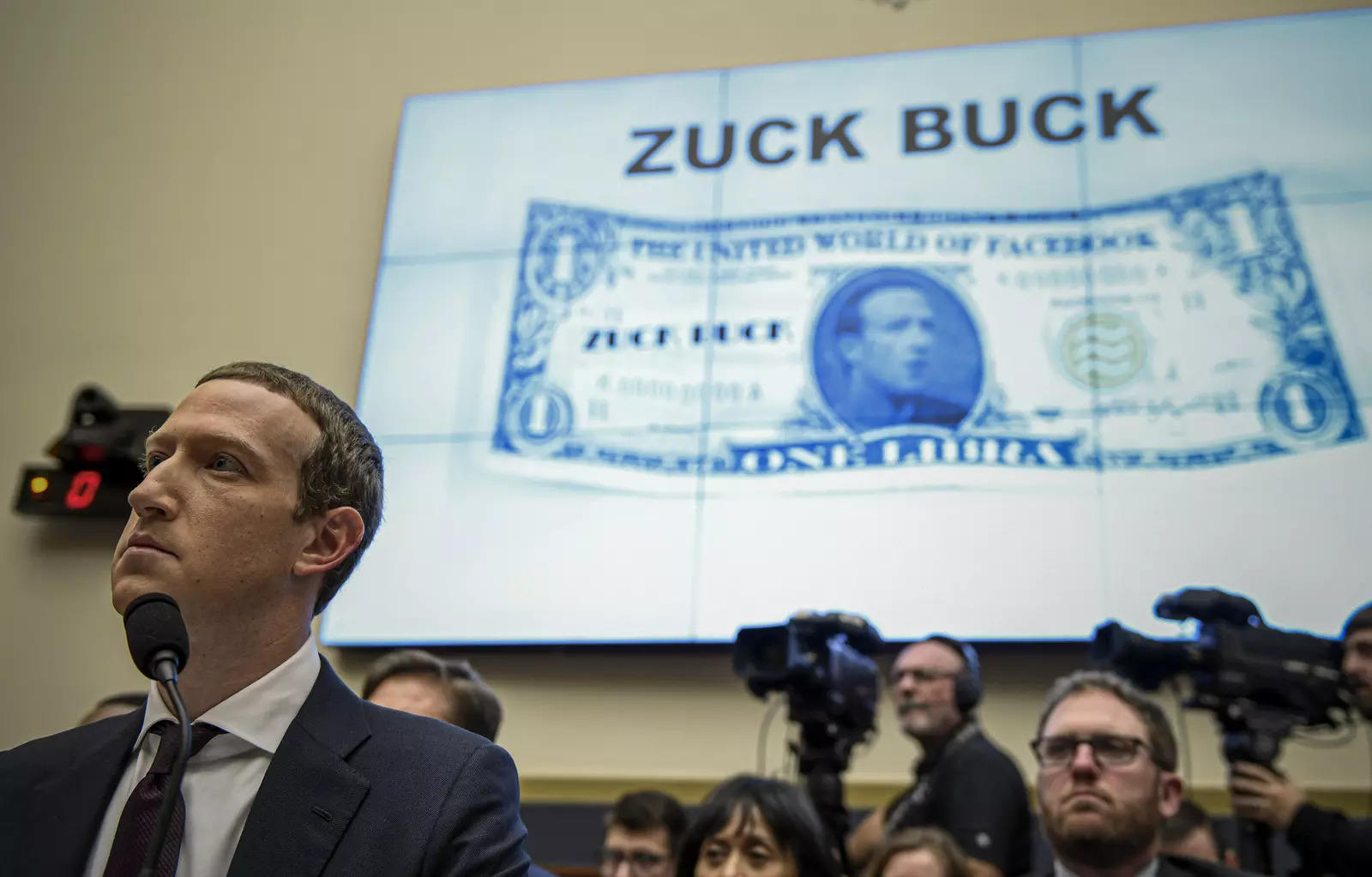 Facebook Chief Executive Officer Mark Zuckerberg, left, testifies before the House Financial Services Committee on Capitol Hill in Washington, about his plans for the new cryptocurrency Libra