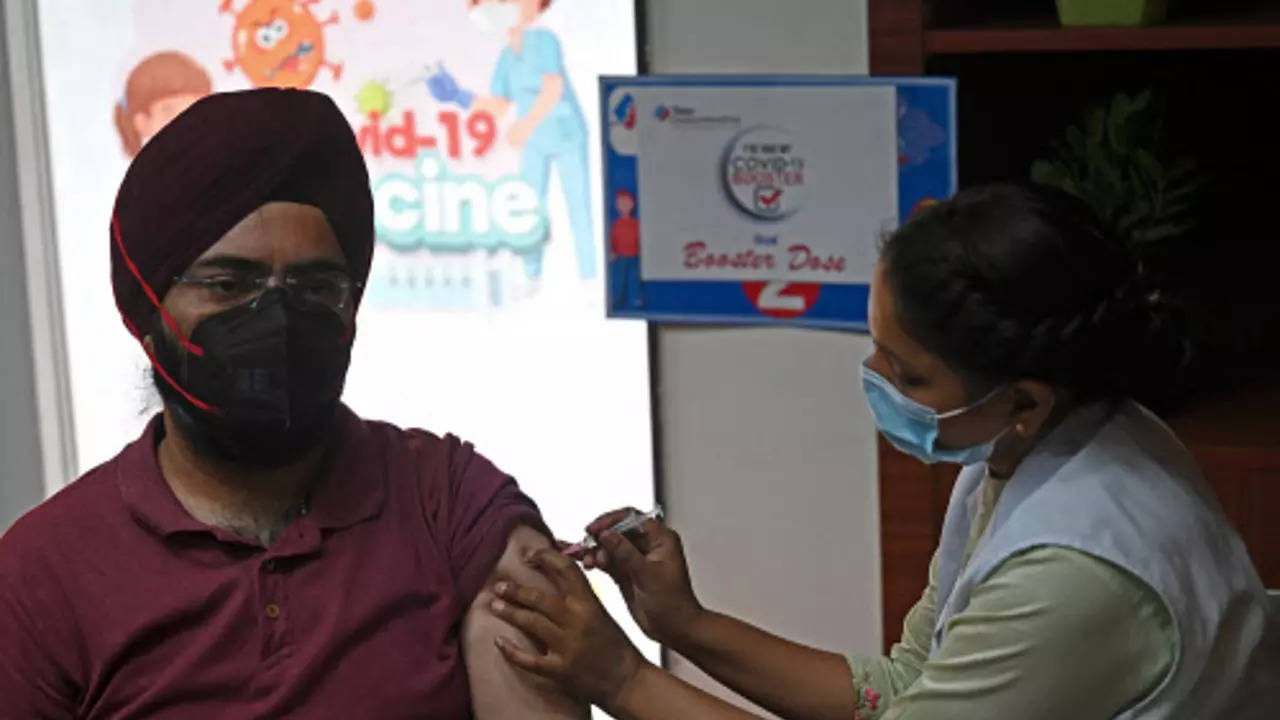 A health worker inoculates a man with a dose of the Covaxin vaccine against the Covid-19 coronavirus at a vaccination centre in New Delhi (AFP)