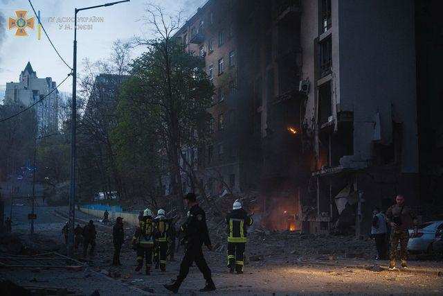 Rescuers work at a site of a residential building damaged by a missile strike in Kyiv 