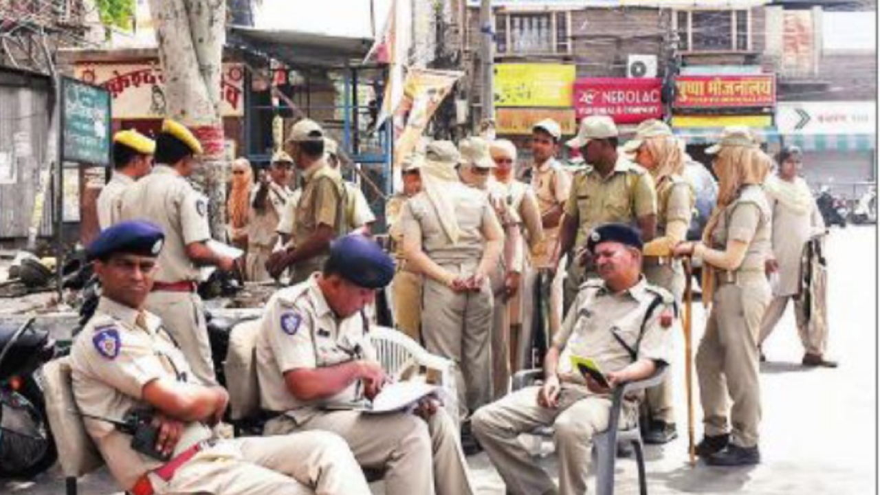 Cops man a city street during curfew hours in Jodhpur on Wednesday.