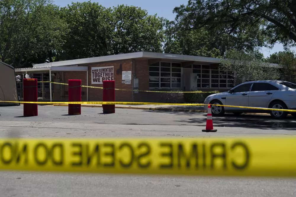 Crime scene tape surrounds Robb Elementary School in Uvalde, Texas.