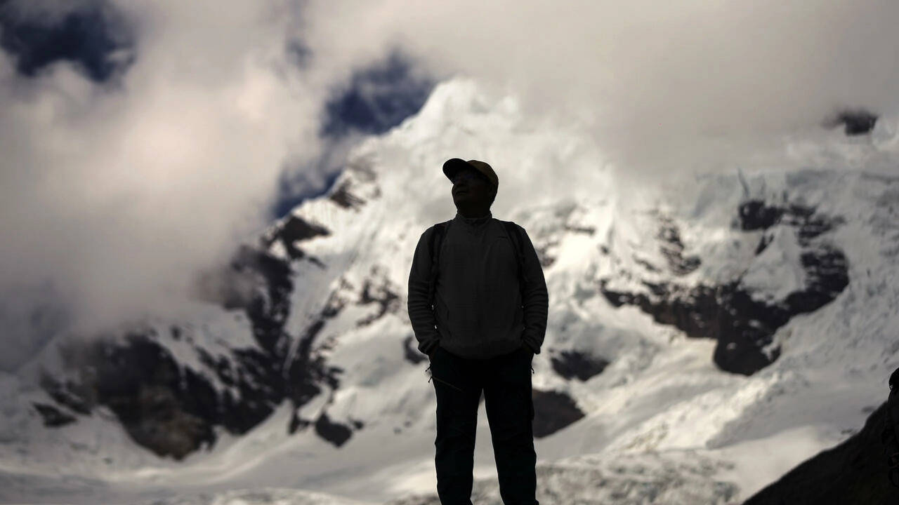 Peruvian farmer Saul Luciano Lliuya looks at the Palcaraju mountain where his Huaraz home is under threat from a melting glacier. (AFP)