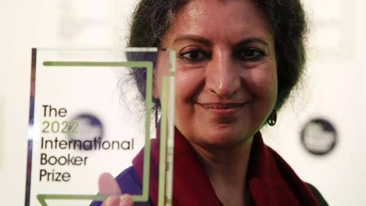 Author Geetanjali Shree poses with the 2022 International Booker Prize award for her novel 'Tomb of Sand' in London.