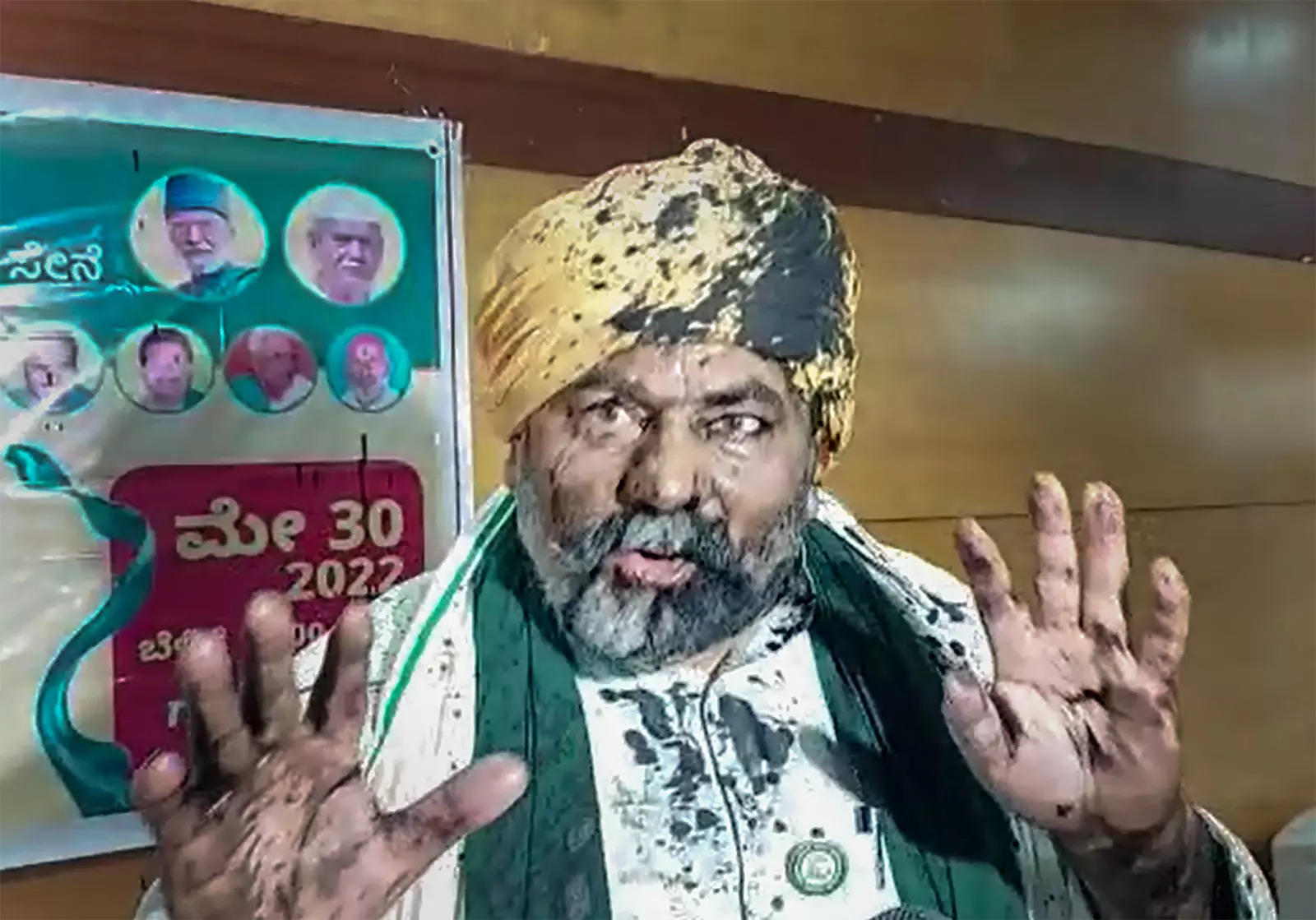 BKU Spokesperson and farmer leader Rakesh Tikait interacts with media after an unidentified person threw ink on him, during an event, in Bengaluru. (PTI)