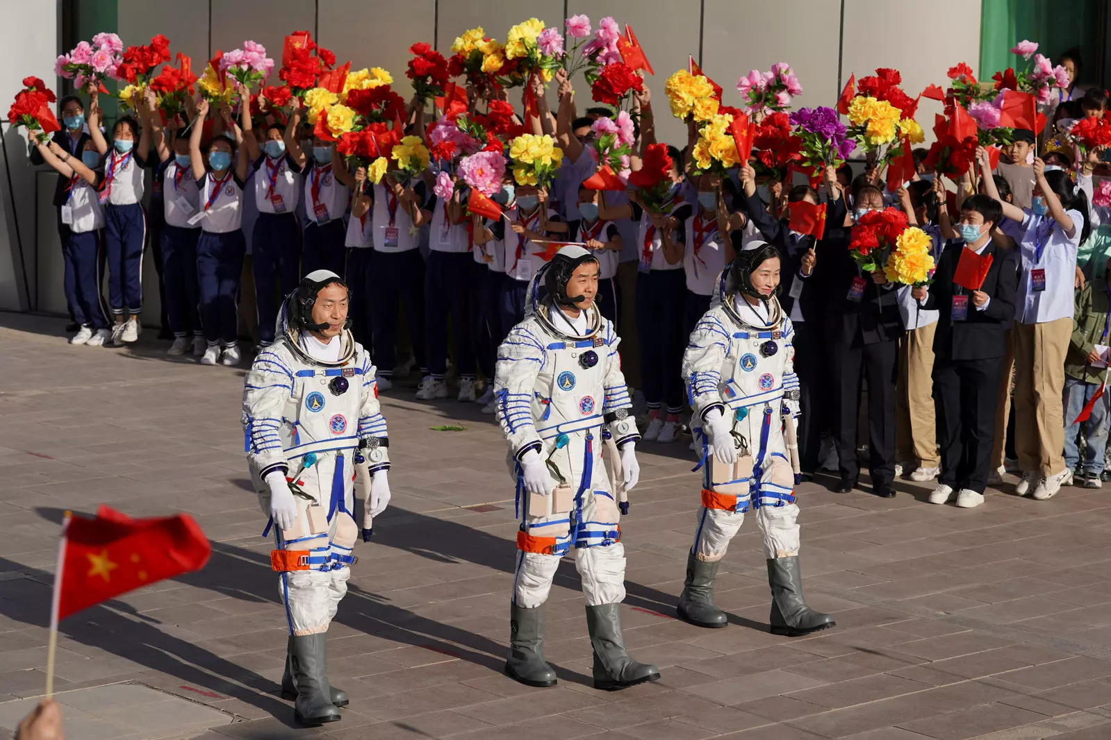 Chinese astronauts Chen Dong, Liu Yang and Cai Xuzhe attend a see-off ceremony before the launch of the Long March-2F carrier rocket, carrying the Shenzhou-14 spacecraft for a crewed mission to build China's space station, at Jiuquan Satellite Launch Center near Jiuquan, Gansu province 