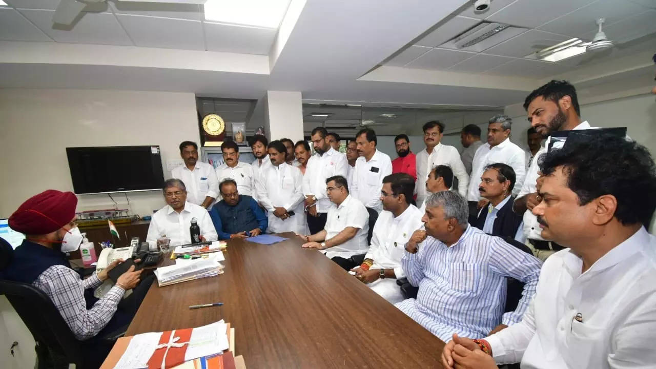 Maharashtra BJP president Chandrakant Patil along with BJP leaders meeting state election commissioner U P S Madan on Monday.