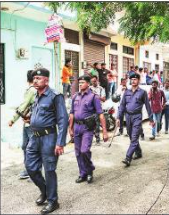 File photograph of policemen taking stock of situation in Udaipur