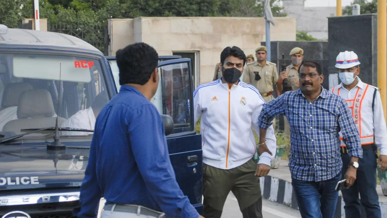Shrikant Tyagi, accused of assaulting a woman, being brought to the Police Commissioner's office after he was arrested by UP Police, in Noida. (PTI Photo)