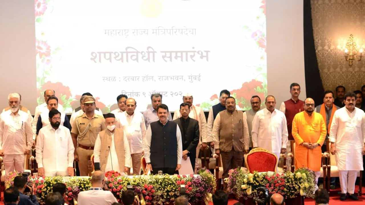 Maharashtra governor Bhagat Singh Koshyari, CM Eknath Shinde, and deputy CM Devendra Fadnavis with 18 MLAs who took oath as ministers, at Raj Bhavan in Mumbai, on Tuesday. ((Photo: IANS)