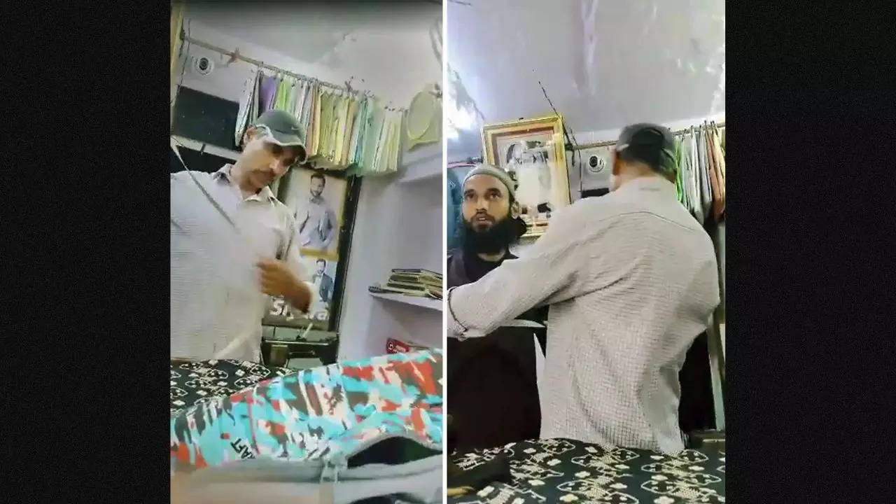 Kanhaiya Lal, a tailor works at his shop before he was attacked by an assailant with a sharp weapon while the other filmed the crime, in Udaipur