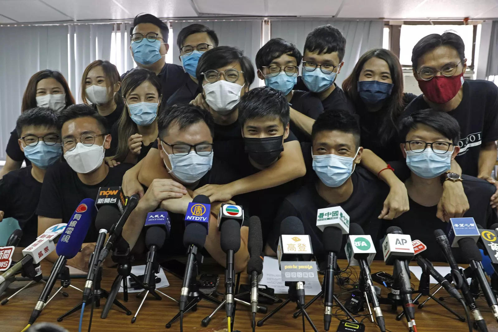 Pro-democracy activists who were elected from unofficial primaries, including Joshua Wong, attend a press conference in Hong Kong on July 15, 2020. (File photo: AP)