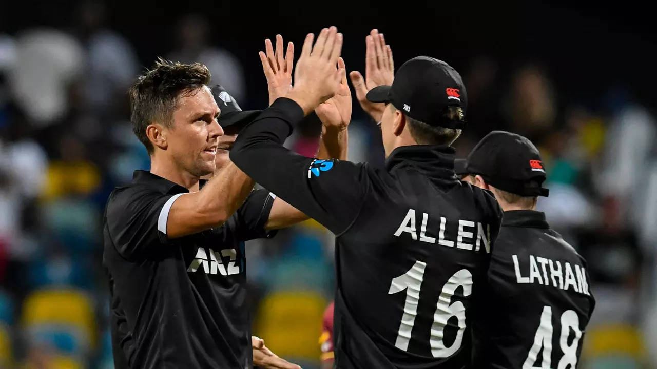 Trent Boult, left, celebrates with his teammates after taking a wicket (AFP Photo)