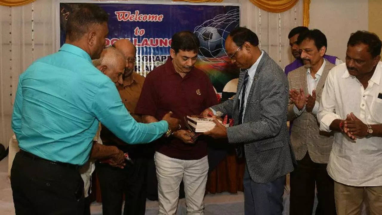 Telangana IT secretary Jayesh Ranjan unveiling former Indian football captain Victor Amalraj's autobiography.