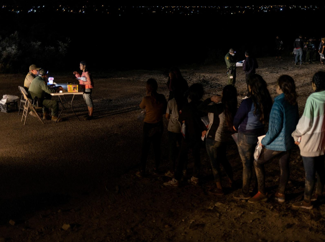 Unaccompanied female migrant children seen on the left as they are registered alongside other asylum seeking migrants who crossed the Rio Grande river into the United States from Mexico in Roma, Texas (Reuters file photo)