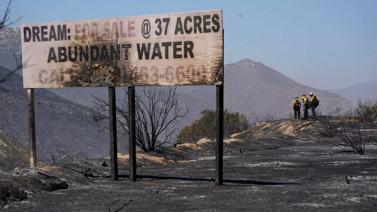 Fire crews work a wildfire on Thursday, Sept. 1, 2022, near Dulzura, California (AP)