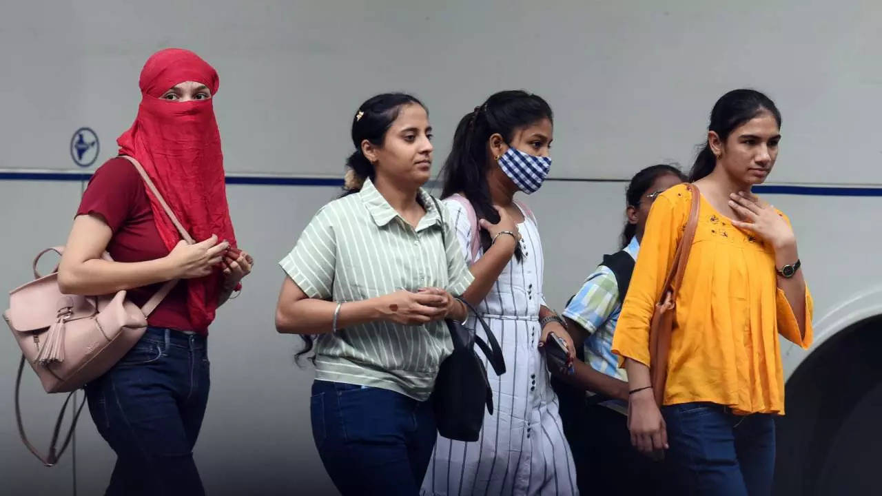 People wearing masks as a precaution against the coronavirus in New Delhi.