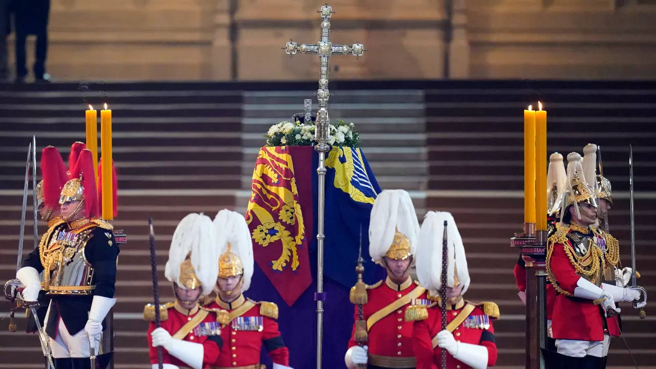 Members of the Life Guards and Blues and Royals stand guard at the coffin of Queen Elizabeth II (AP)