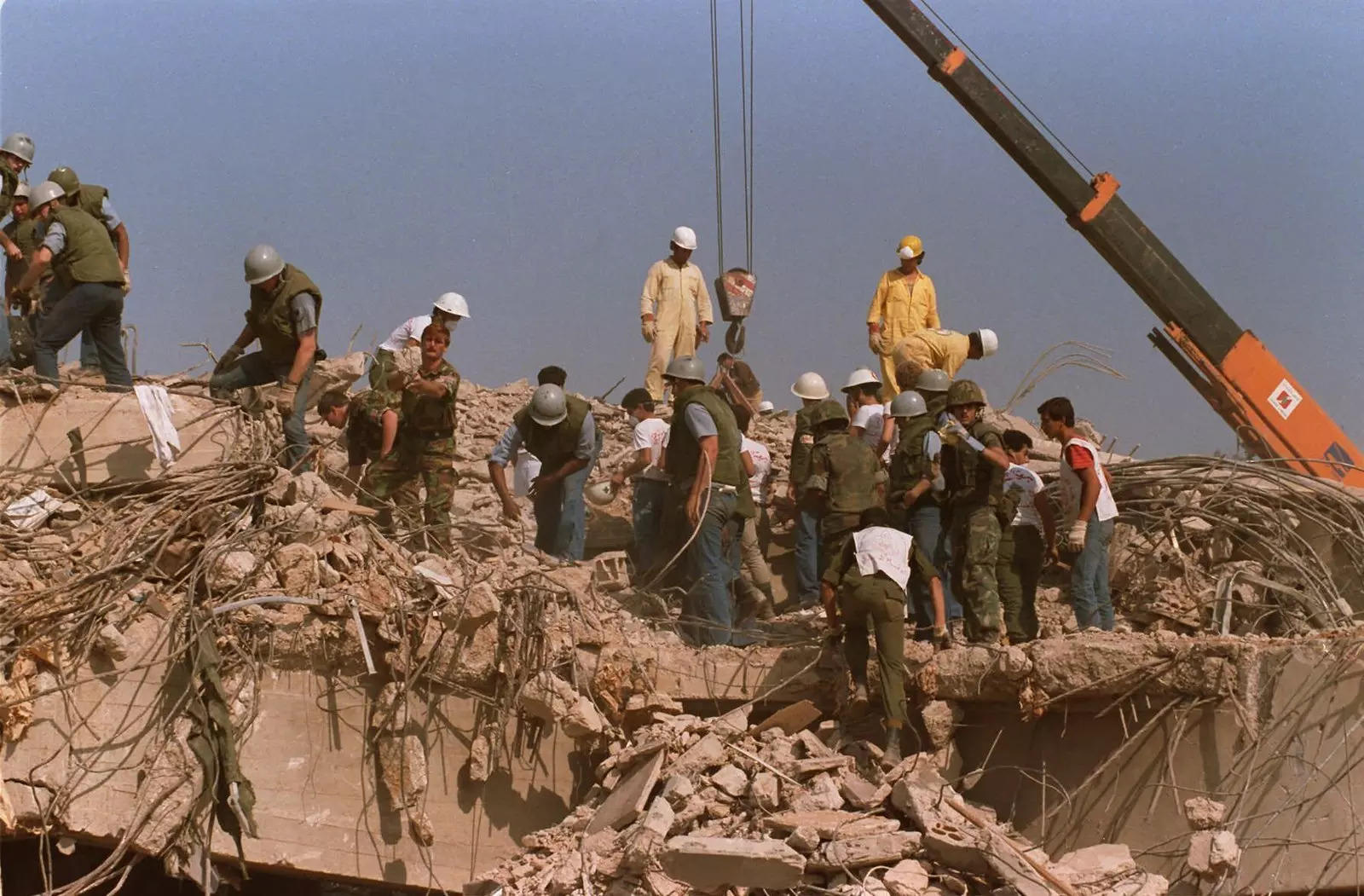 Rescue workers sift through the rubble of the US Marine base in Beirut on Oct0ber 23, 1983, following a massive bomb blast that destroyed the base and killed 241 American servicemen. Iran told the United Nation’s highest court on Monday that Washington’s confiscation of some $2 billion in assets from Iranian state bank accounts to compensate bombing victims was an attempt to destabilize the Iranian government and a violation of international law. (File photo: AP)