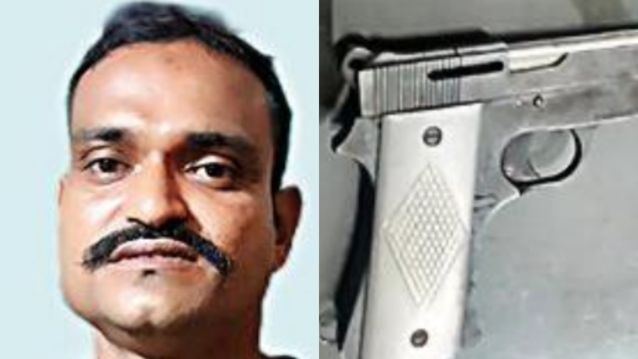 Ajay Kumar Prasad, a native of Bihar, with his pistol