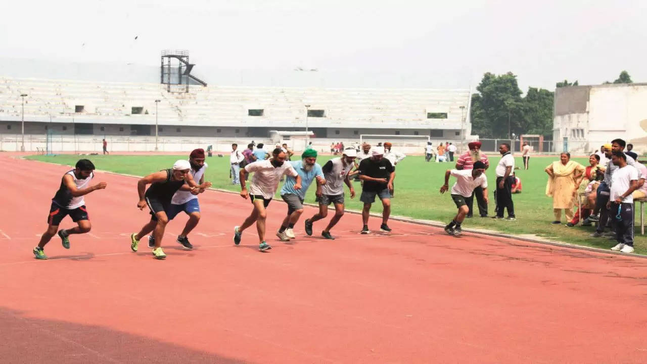 Participants show their mettle in the 100m athletic event