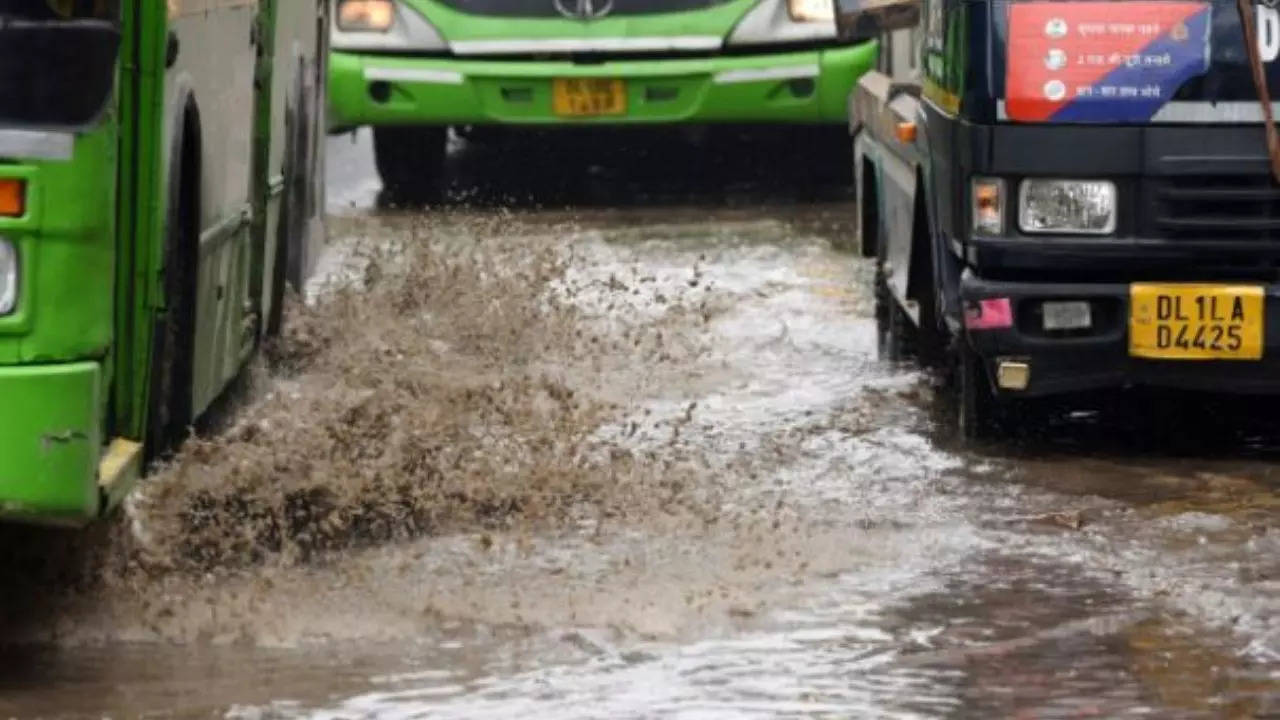 Waterlogged Mother dairy road after rains in East Delhi on Friday. (TOI photo by Sanjeev Rastogi)