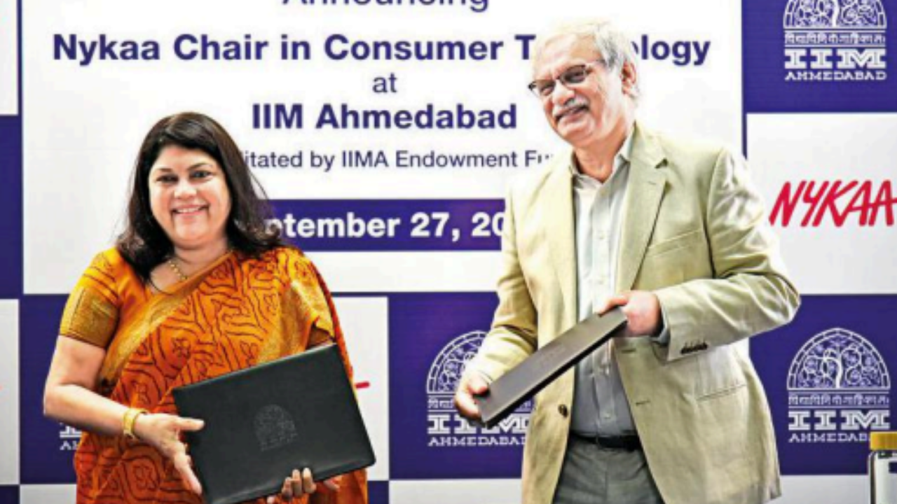 Founder and CEO of Nykaa Falguni Nayar (L) and Errol D’Souza, director of IIM-A, during the MoU signing ceremony at IIM-A on Tuesday 