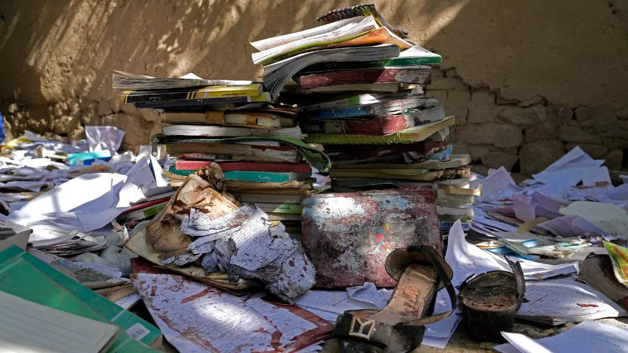 A view of the bloody books and supplies that left from Friday's suicide bombing on a Hazara education center in Kabul. (AP photo)