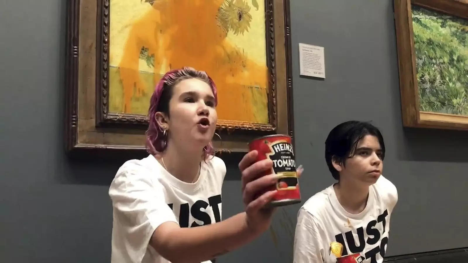 The two protesters who have thrown tinned soup at Vincent Van Gogh's famous 1888 work Sunflowers at the National Gallery in London, Friday. (File photo: AP)